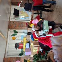 A child receiving his Santa Shoebox