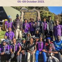 The image above is the list of all mountain climbers in pose, When they are at route to reach Uhuru Peak.