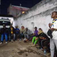 In this Image one of the member of 25 Scouts, Providing education to community and other scouts on several Issues including fighting and combating with disasters.