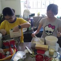 Debra and Zofia preparing ingredients for baking