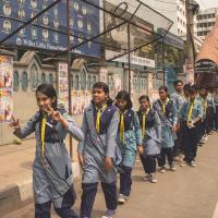 A picture of the scouts going to the streets in a file