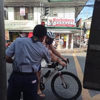 Rover Scout Reyes giving out informative Flyers to a Cyclist