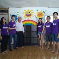 Group picture with the village chief after completing the bookshelf.