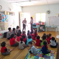 Debra and Zofia introducing alphabets to the children