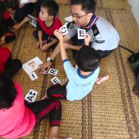 Jack teaching the children to spell the nouns
