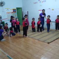 Playing a few ice breaking games to start the class