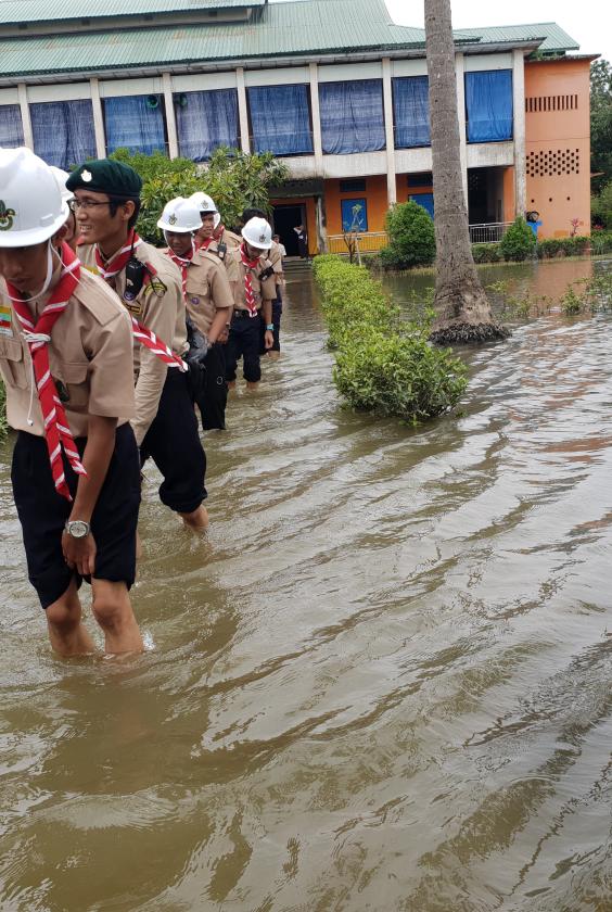 scouts crossing a flood