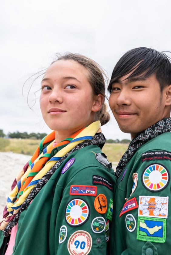 Scouts showing their badges on their shirts
