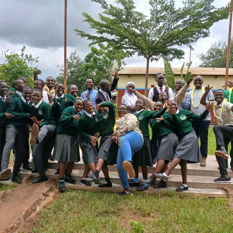 Students, teachers and Scouts after planting fruit trees at Bishop Patrick Kalilombe Catholic High School in Dowa District.