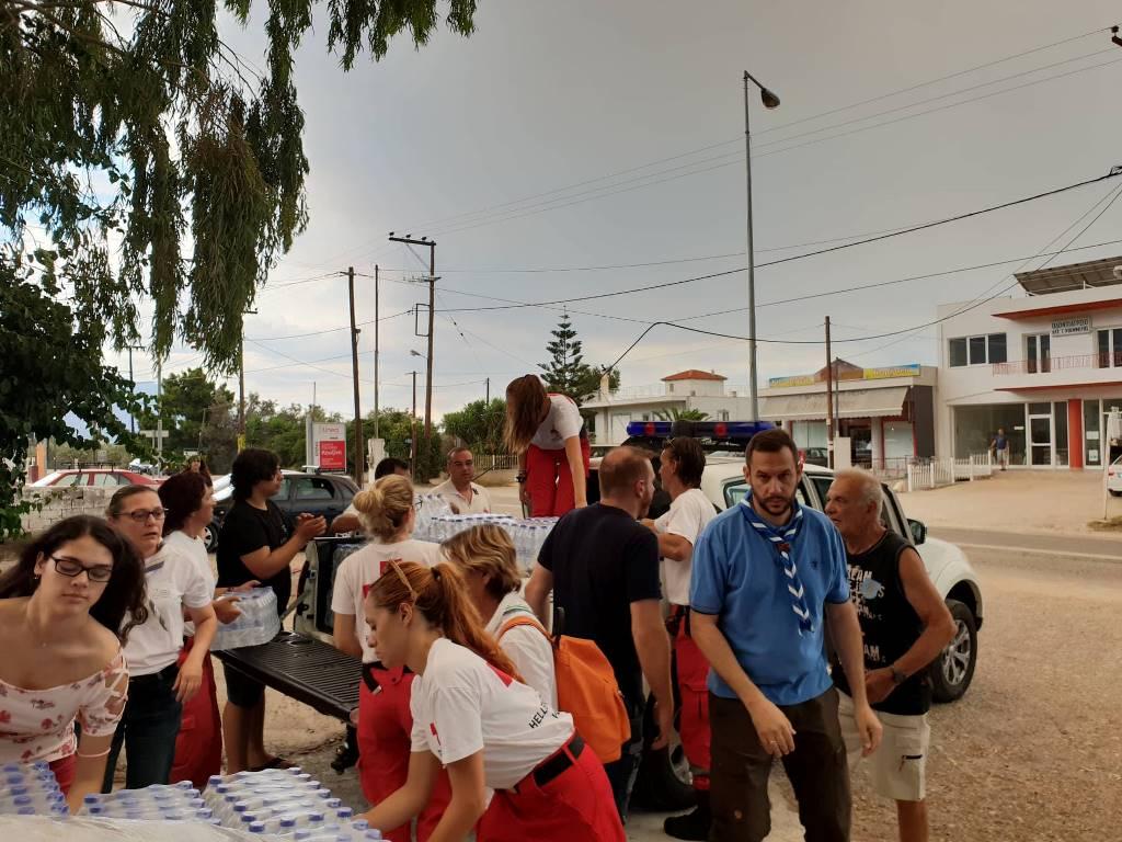 The Scouts of Greece stand by the fire affected