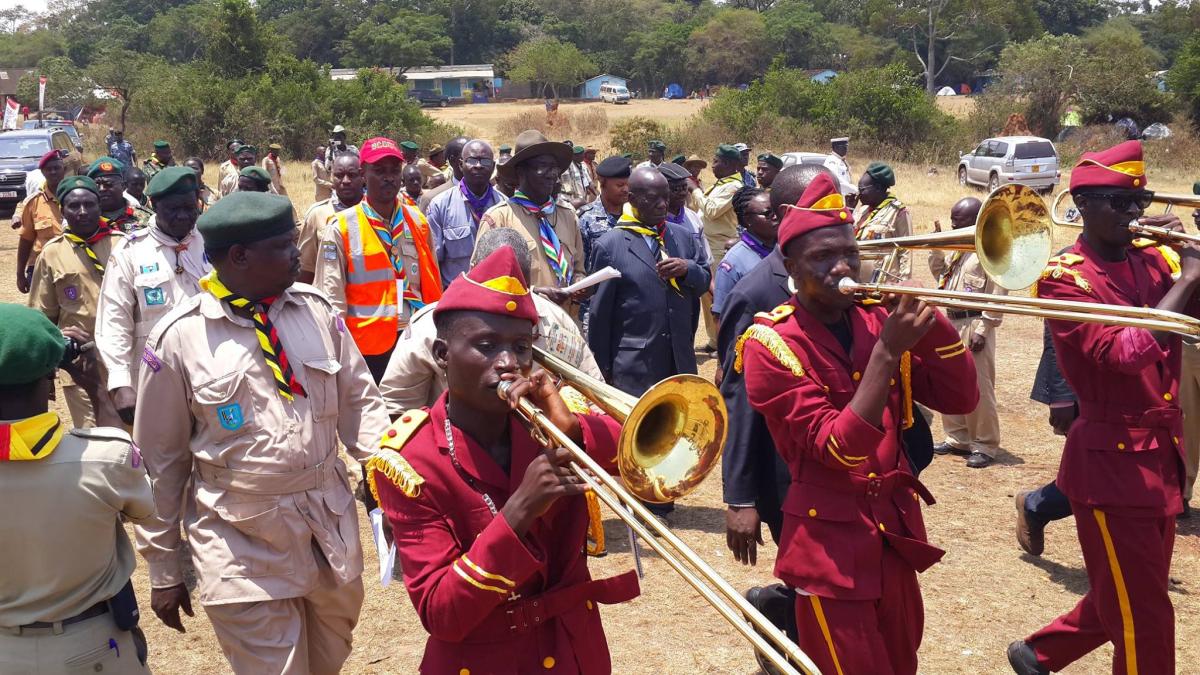 Ugandan Scouts mobilizing people and creating awareness using brass band