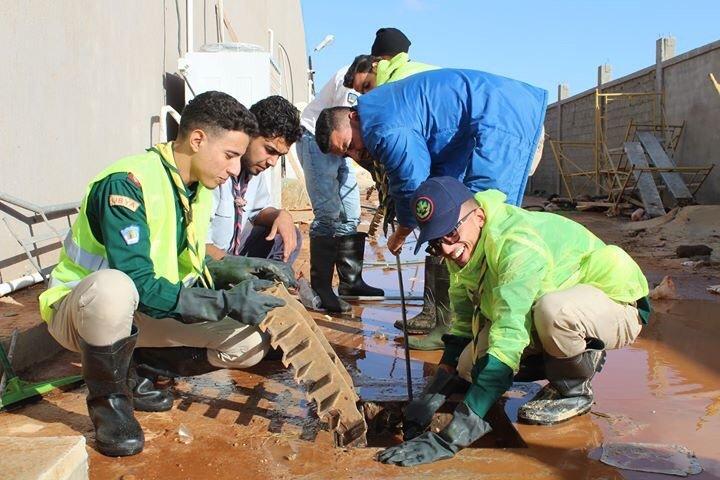 Benghazi Scouts Commission initiated a volunteer campaign to help resolve the crisis of the constant flooding of its city's streets