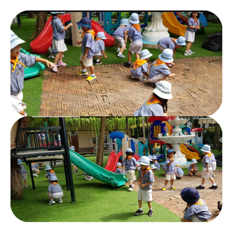 เด็กช่วยกันเก็บใบไม้กิ่งไม้แห้งกัน ทำให้บริเวณดูสะอาดตา