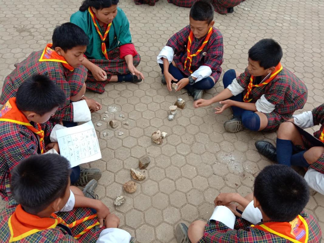 scouts hand experience on trail sign