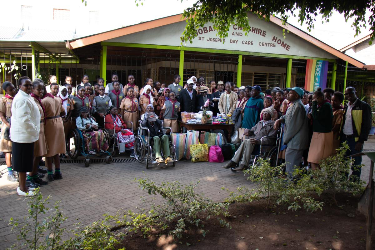 Girl Scouts in Kenya show love to the aged persons at Cheshire Home for the Aged