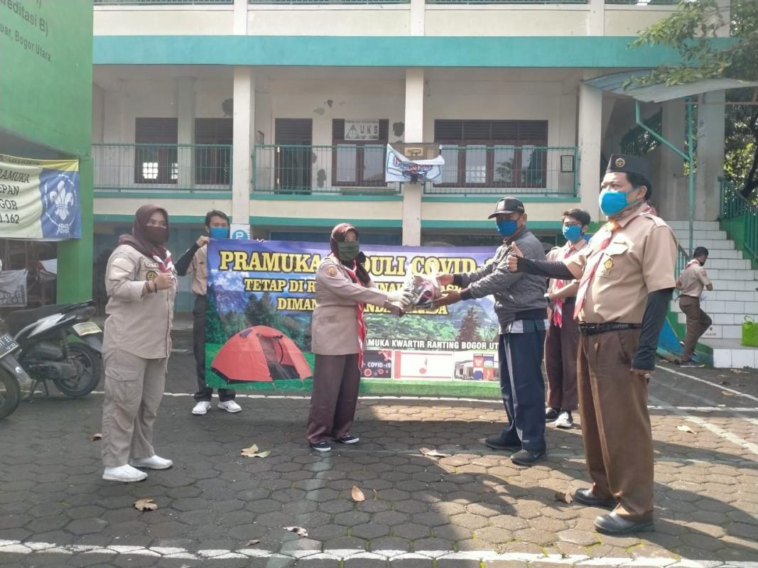 The Scout Cares (Pramuka Peduli) of North Bogor District Council - Bogor City Regency Council - West Java - PSBB (Large-scale Social Distancing) Socialization and Distribution of 1500 Masks