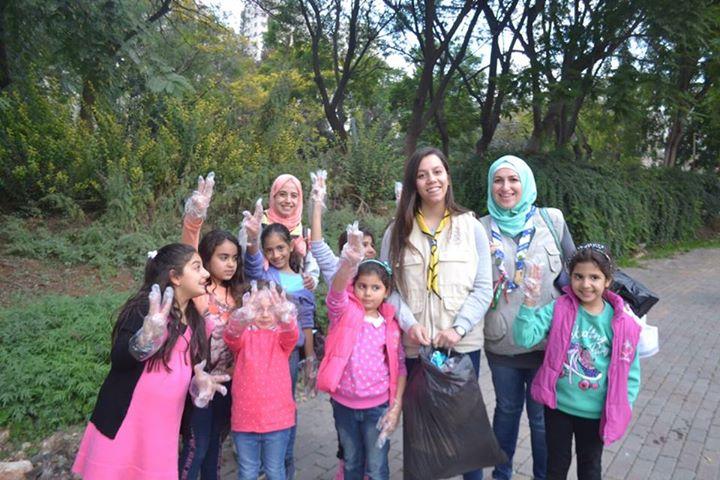 Cleaning our community park as part of the environmental responsibility تنظيف المنتزه كواجب بيئي 