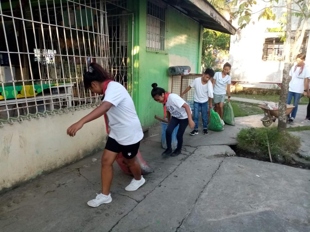 ENHANCEMENT OF THE HOME ECONOMICS BUILDING (CLEANING THE GARDEN AND PLANTING FLOWERING/ORNAMENTAL PLANTS )