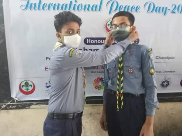 Distrubuting Mask To Scouts in "International Peace Day-2020 & Work Shop On SCOUT's Better World Framework" Organised by "Hasan Ali Gov't High School Scout Group,Chandpur.