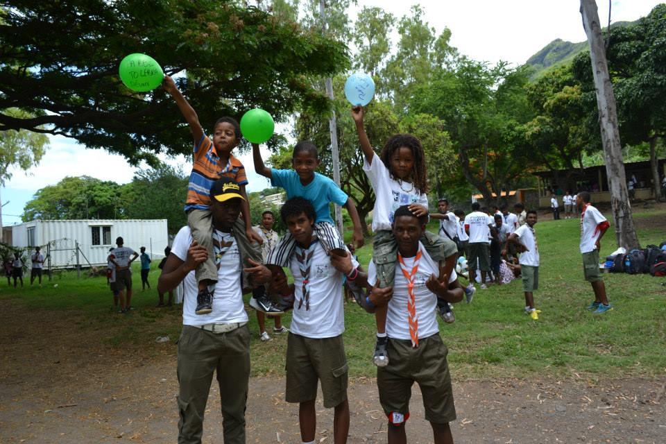 scouts putting a smile on a child face (half day with children from poor regions)