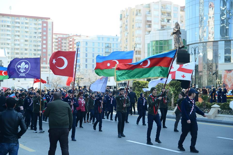 Scouts of Azerbaijan , Turkey and Georgia have marched to Khojaly Genocide Memorial for commemorating of the victims of Khojaly tragedy