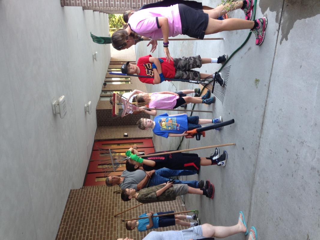 Cub Scout Pack 342 of Newport News, VA clean school grounds at BC Charles Elementary School