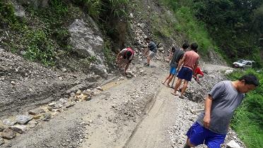 community services in clearing monsoon road block.