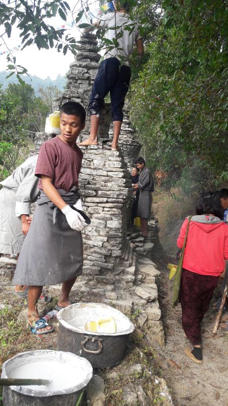 Community services in white washing stupas(chorten)