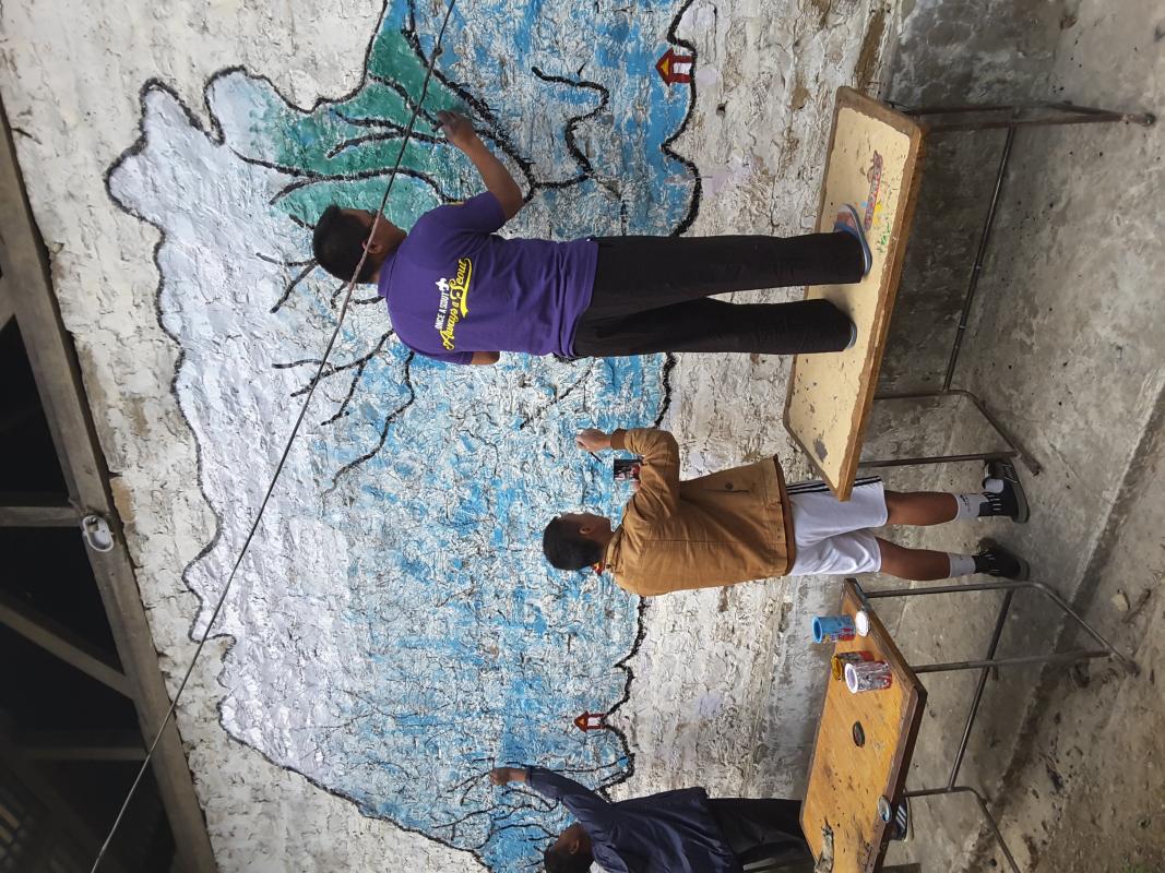 Painting of national flag pole and bhutn map on the wall