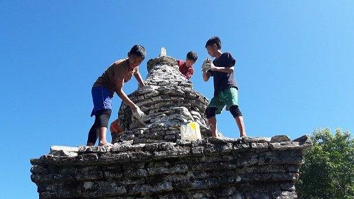 White washing of stupa's during decending day of Lord Buddha.