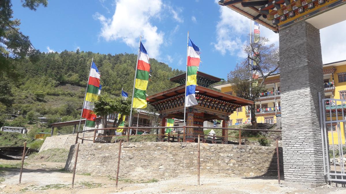 Erection of prayer flags around Mani Dungkhor