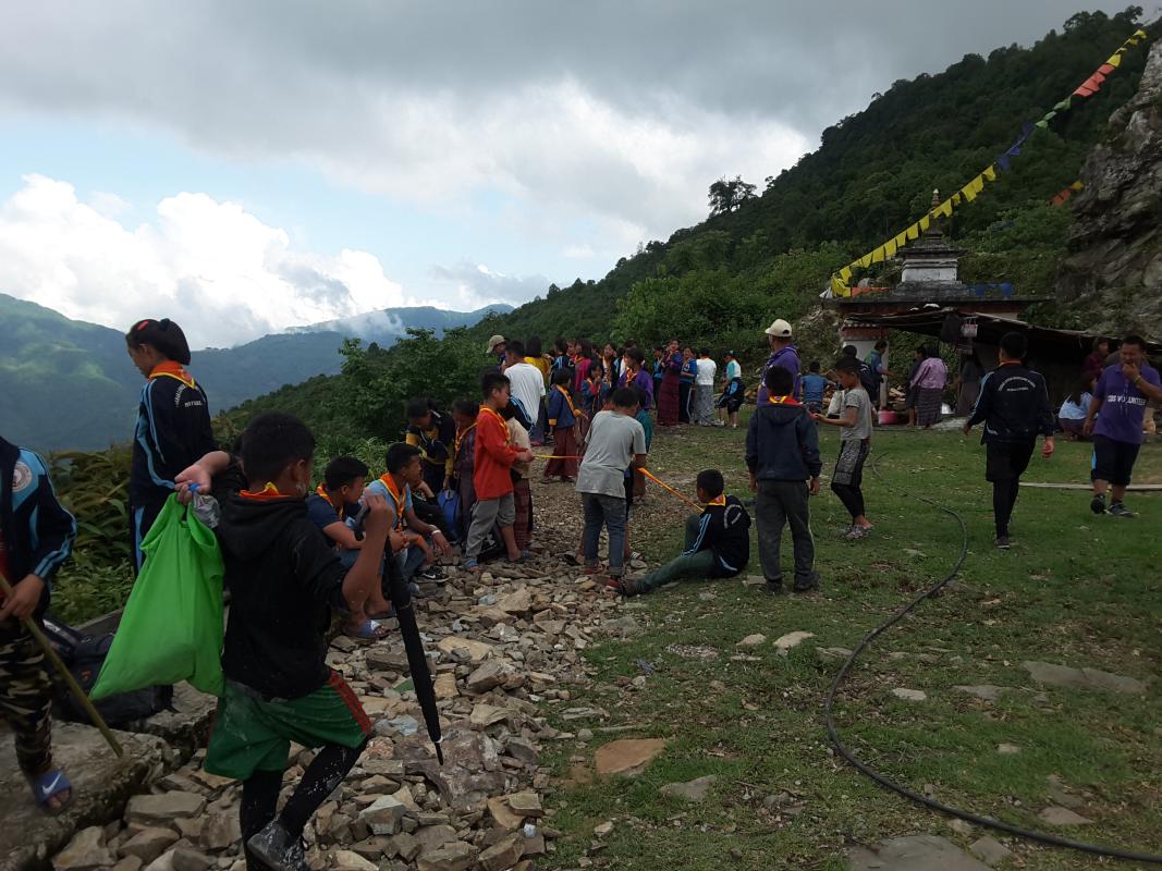 Community service White washing of chorten by scouts