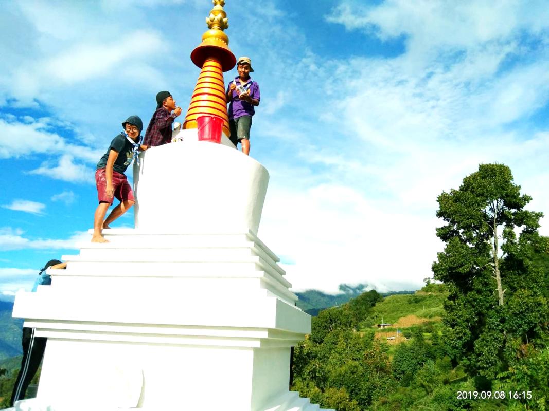 Making beautiful things happen .White washing of stupas.