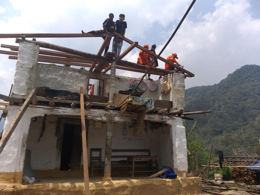 Restoring wind storm-struck houses at Chhudzom Gewog