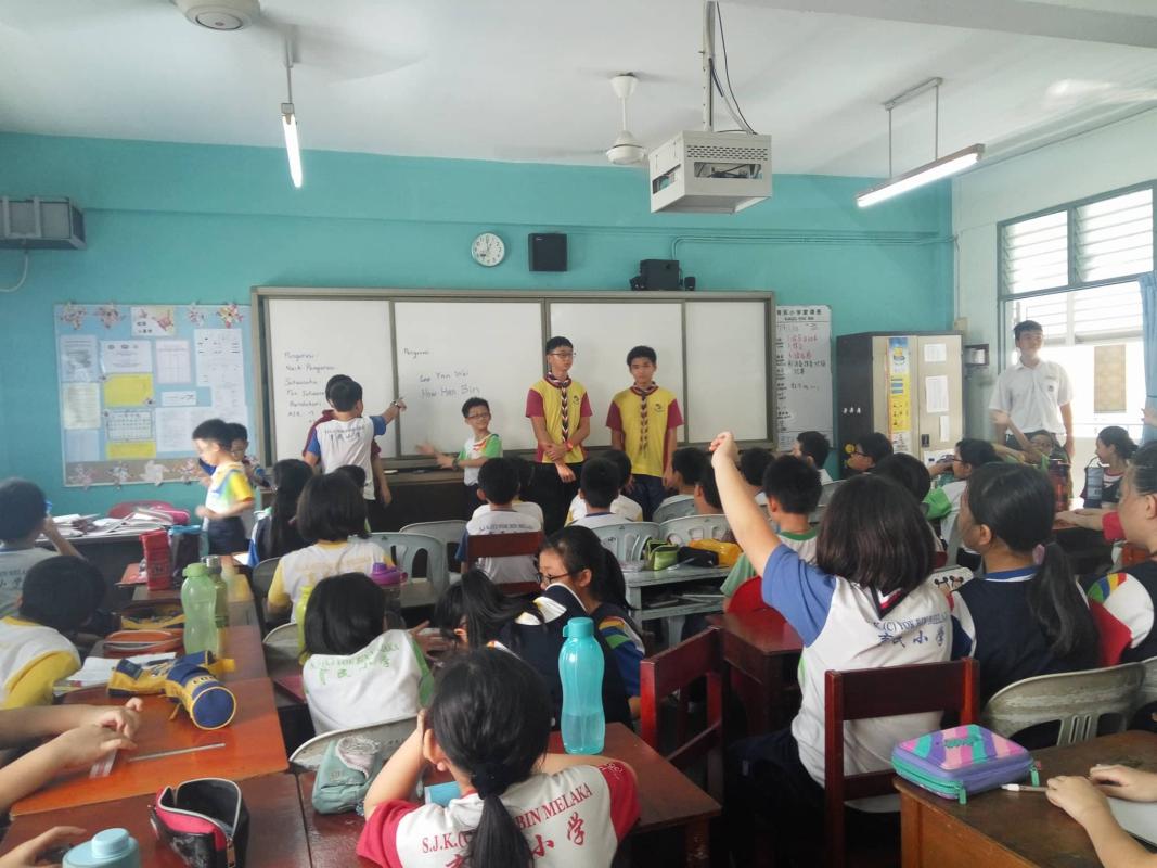 Helping to teach scout to the primary school students