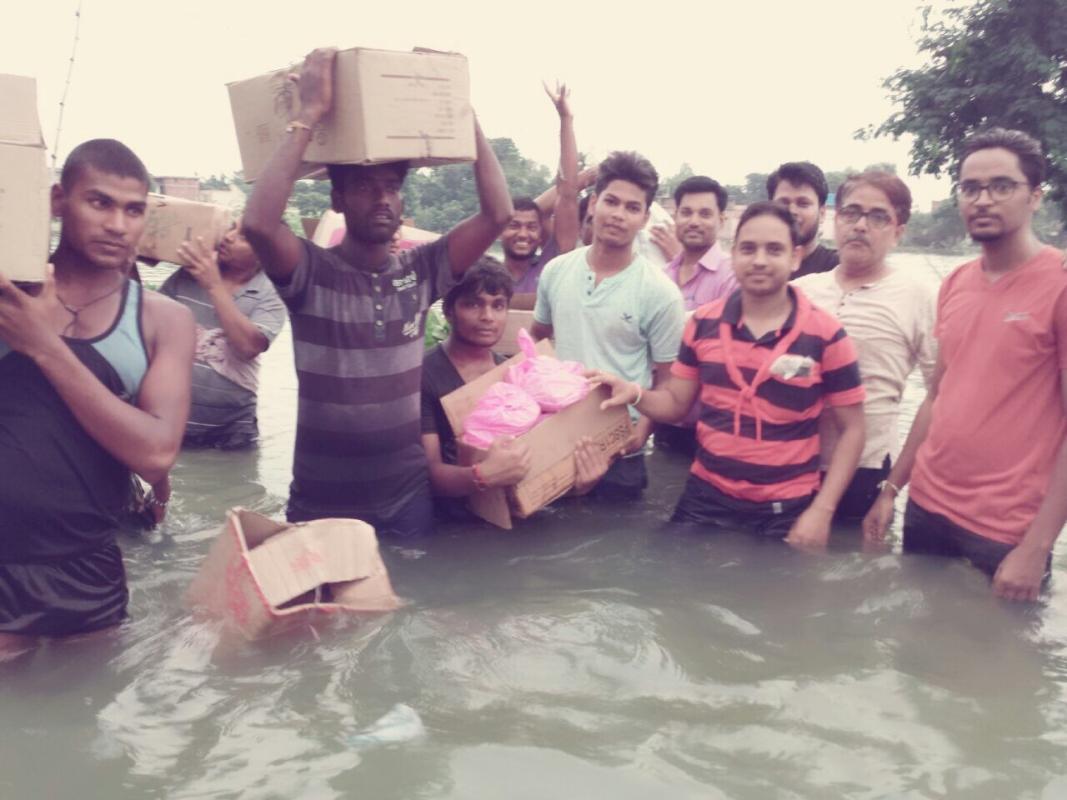 Food for flood peoples by mop coordinator ,scouts and social peoples 