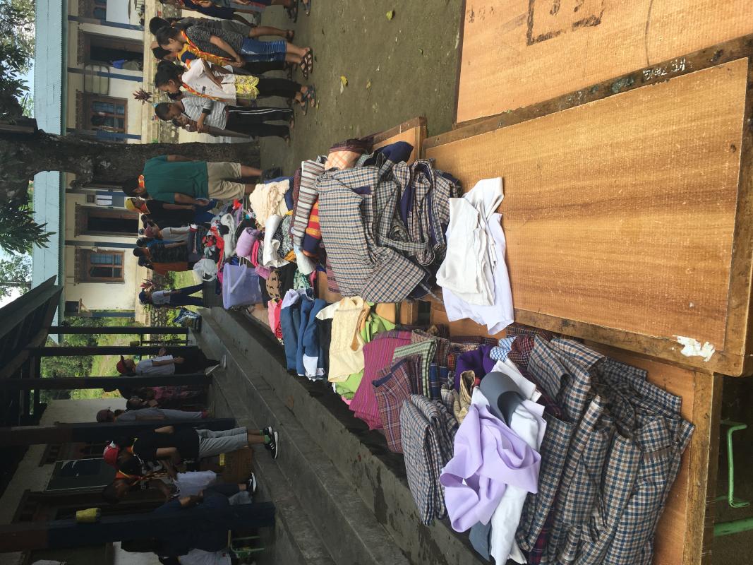 Distribution of jumbled clothes and gifting the teaching aids 