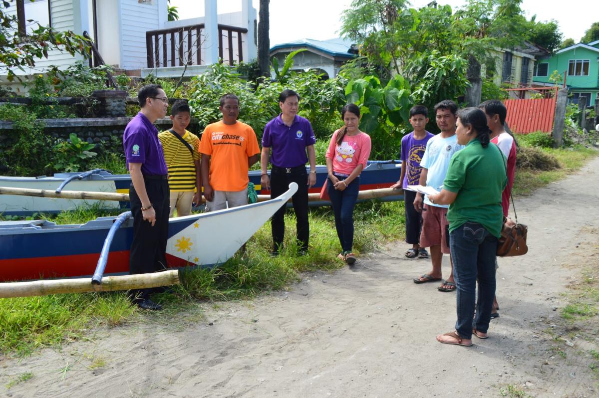 Provide locally-made motor boats and fish nets for three Scout families