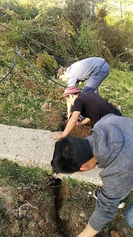 Repairing school water supply. 