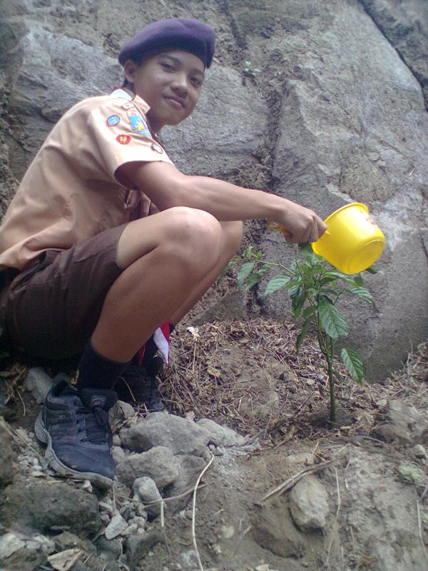 Scout of Indonesia in Badung Regency planting a bamboo