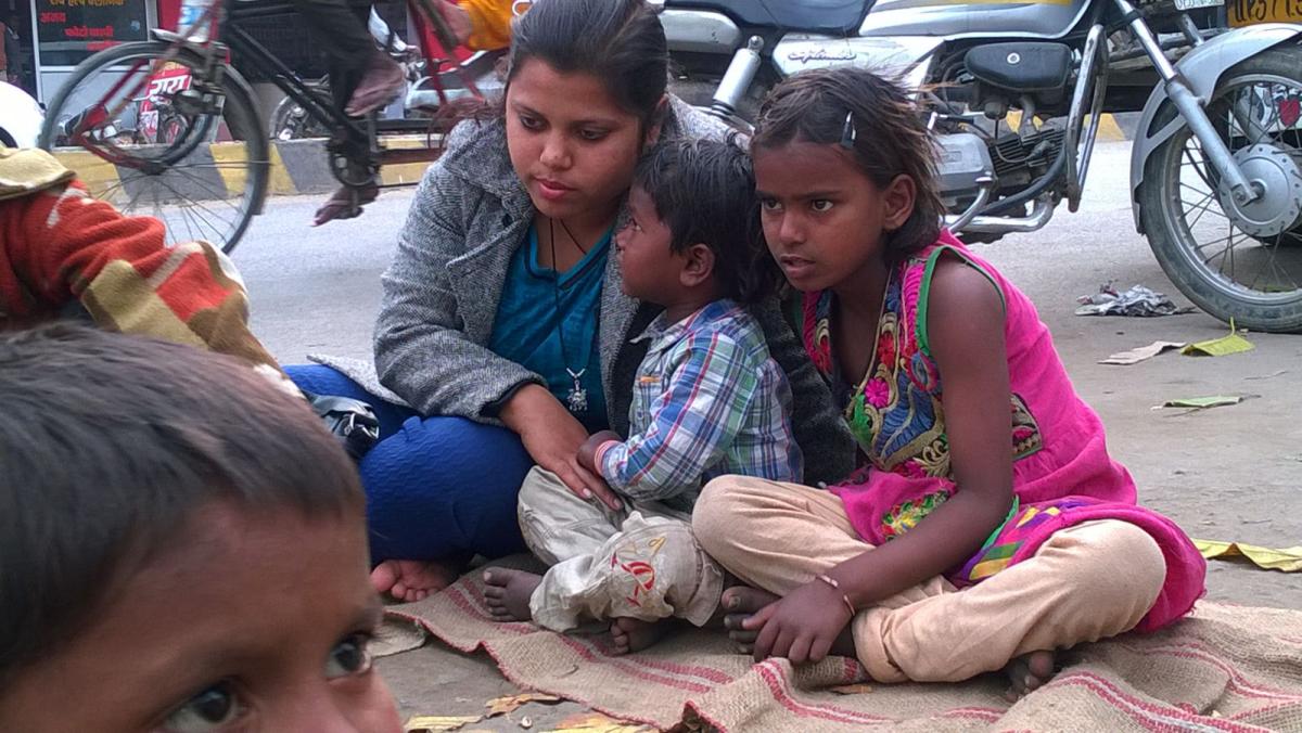 Poor child distributing food