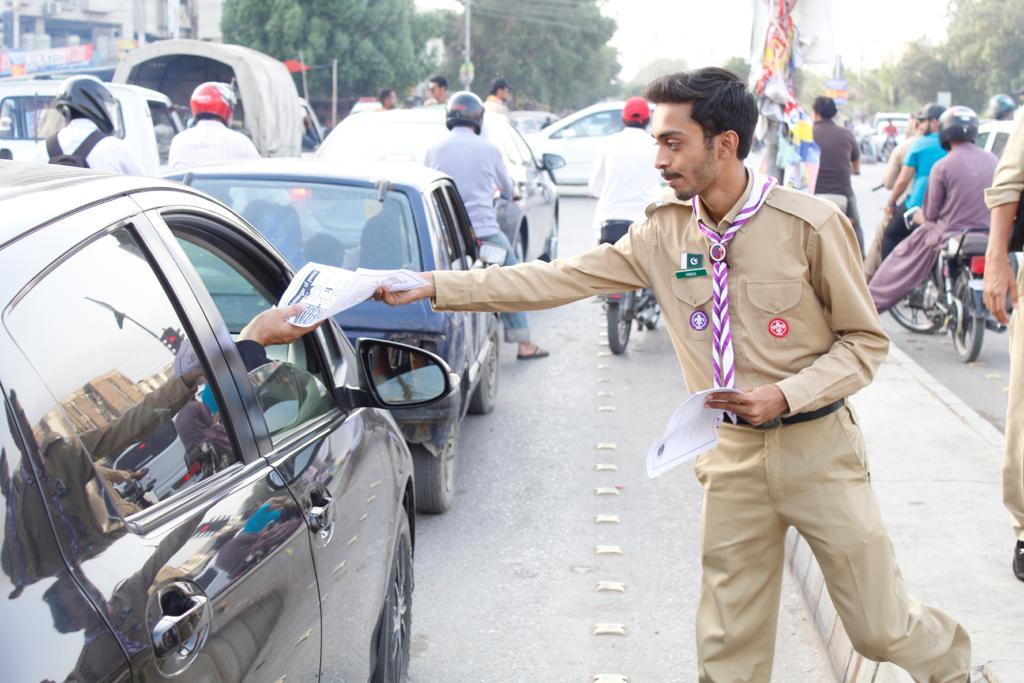 Traffic control and pamphlet distribution regarding traffic rules and scouting