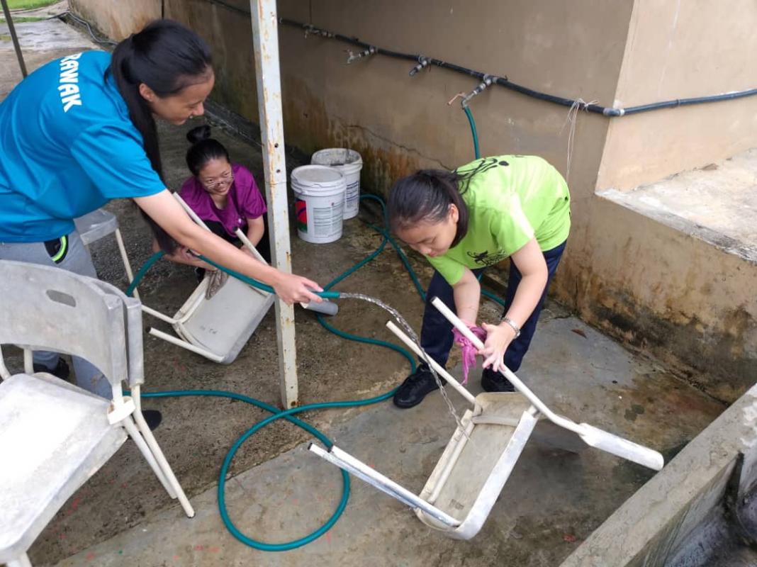 Cleaning and Scrubbing the used Chairs