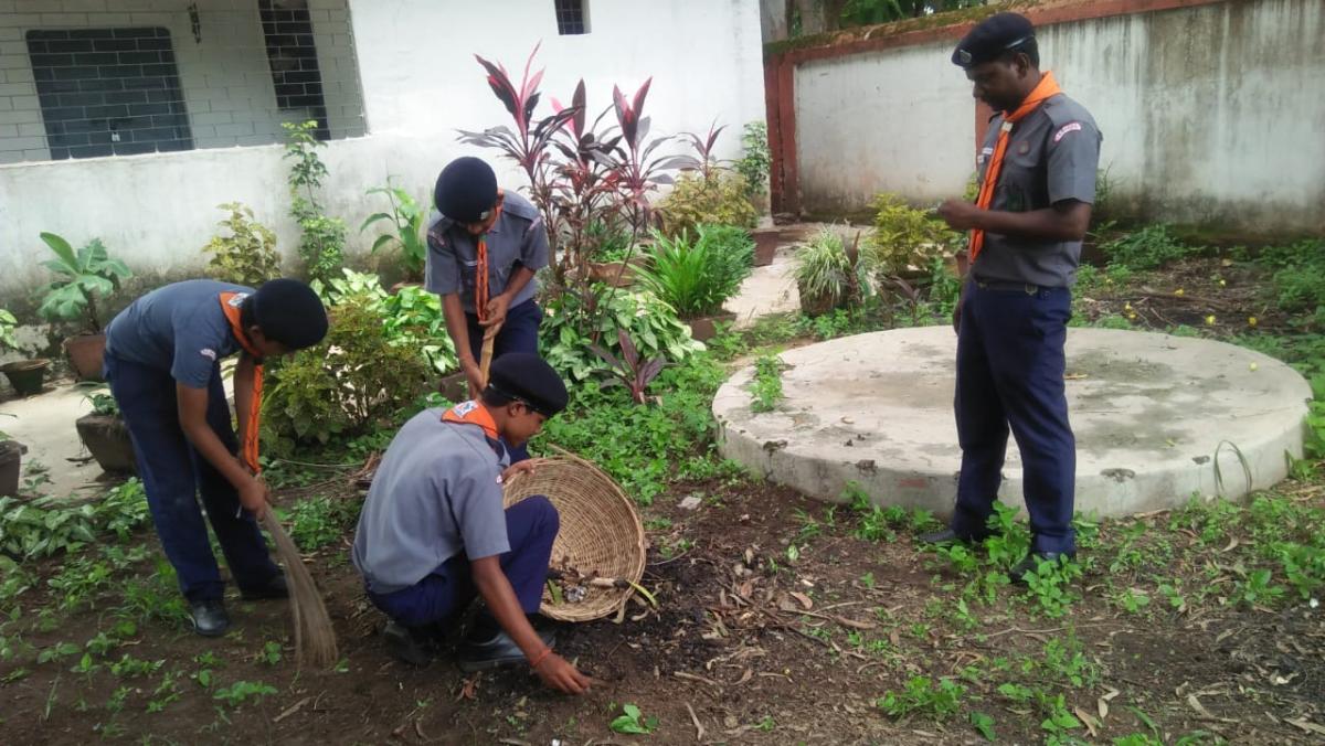 cleaning the scout Den.