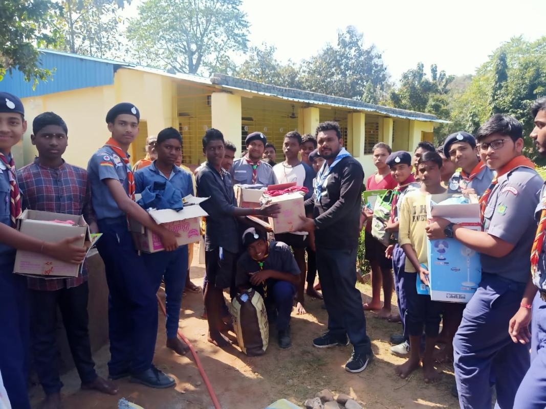 Giving food and cloths to the children