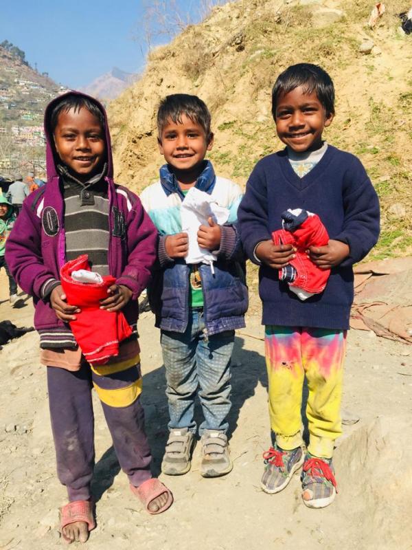 Rovers and Rangers of Kullu College distributed clothes in the slum area