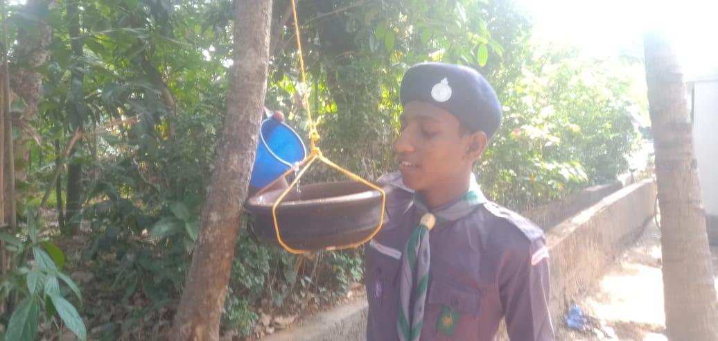 an earthen pot for thirsty birds 