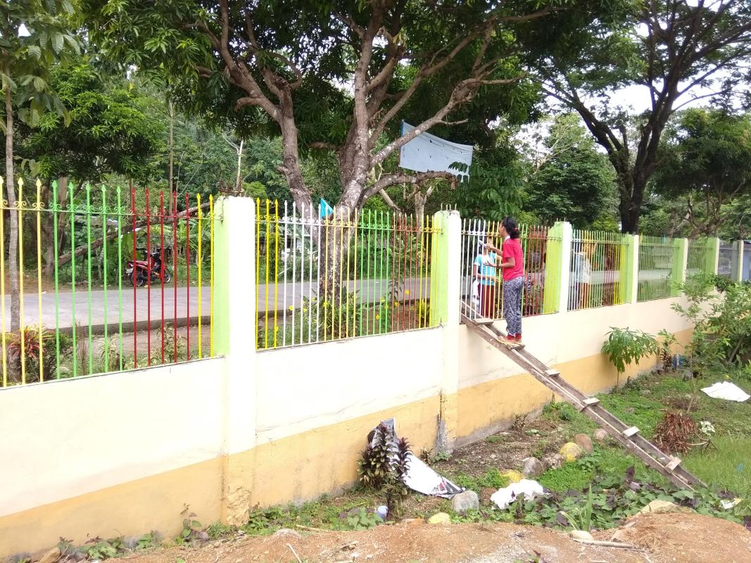 PAINTING OF SCHOOL FENCE