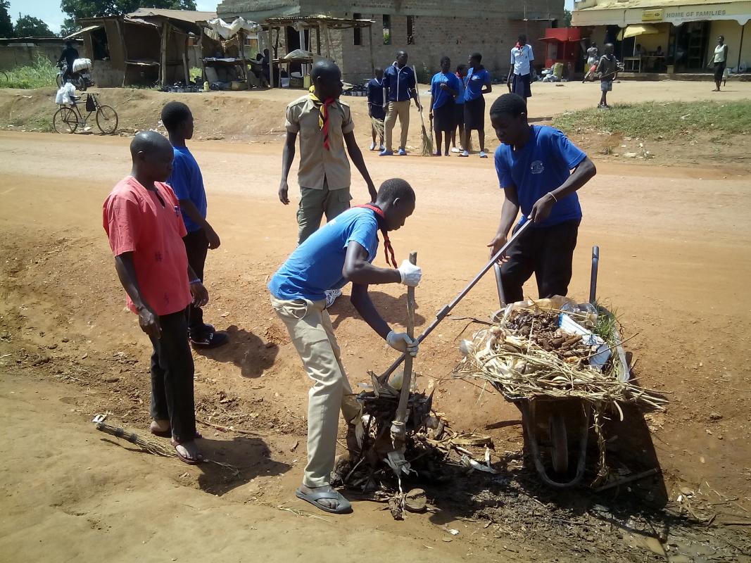 Ascout conserves nature,venture scouts cleanup atrading centre in soroti town (uganda)