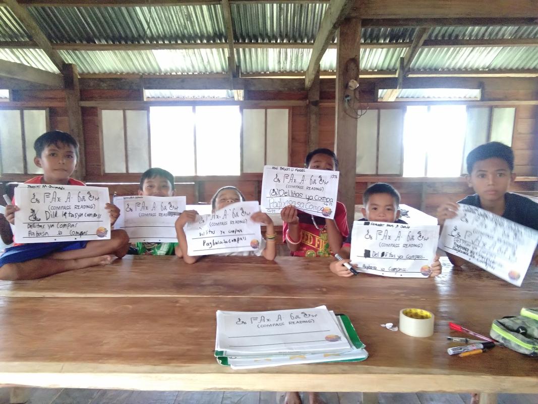 Teaching the indigenous Eskaya Scouts about their indigenous language and unique writing system. (BESO)